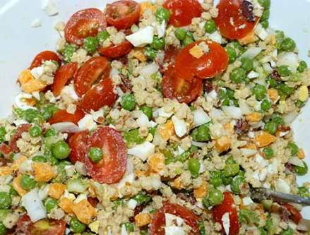 Pea salad mixture with tomatoes added.